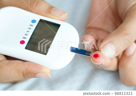 Handchecking Diabetes And High Blood Sugar With Digital Blood Pressure  Monitor And Covid19 Test Results Health And Medical Concepts Stock Photo -  Download Image Now - iStock