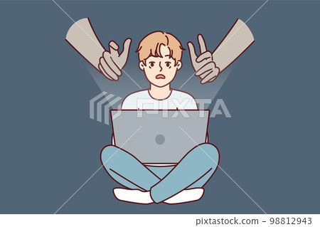Hands reaching out to teenage boy using laptop with internet without parental control 98812943