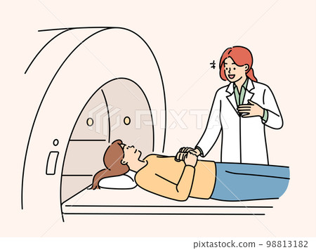 Professional woman doctor prepares patient for tomography procedure in clinic Professional woman doctor prepares patient for tomography procedure in clinic 98813182