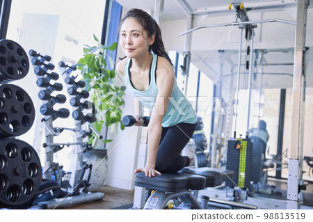 Young woman training in the gym Young woman training in the gym 98813519