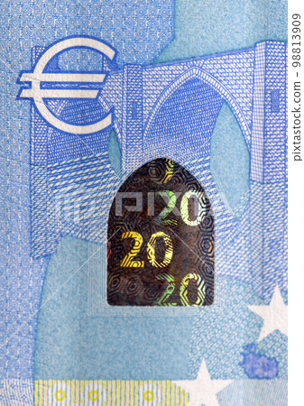 Twenty euros orange color photographed close-up 98813909