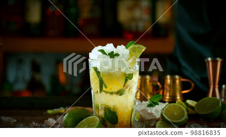 Mojito cocktail on the bar, dark toned background 98816835