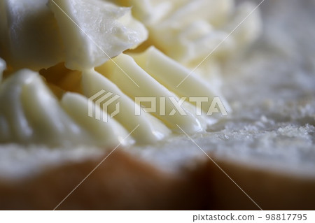 A pile of margarine on toast 98817795