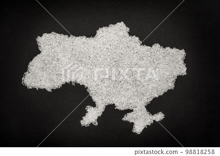 rice grains on a black background in the shape of a map of Ukraine rice grains on a black background in the shape of a map of Ukraine 98818258