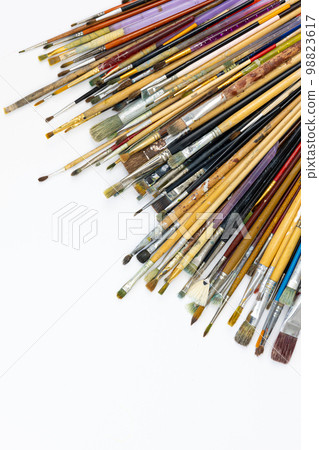 Many brushes for painting on a white background, top view. 98823617