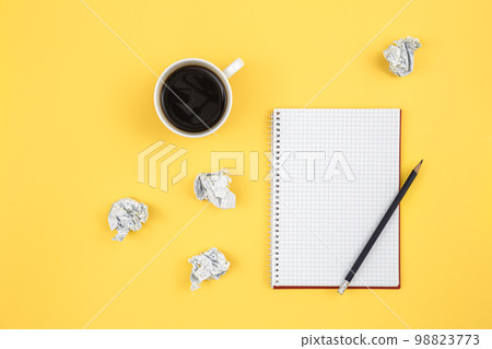 Empty notebook with cup of coffee and crumpled paper balls, flat lay. Empty notebook with cup of coffee and crumpled paper balls, flat lay. 98823773