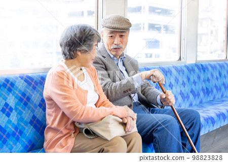 Senior couple going on a trip by train 98823828