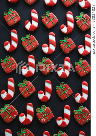 Christmas handmade gingerbread cookies covered with multi-colored icing. Christmas handmade gingerbread cookies covered with multi-colored icing. 98824828