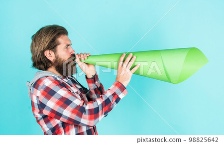 False advertising concept. Handsome man shouting through speaker. loud announcement. dont be silent. vote. urge the public. Do not be afraid to express your opinion. free man shouting into megaphone False advertising concept. Handsome man shouting through speaker. loud announcement. dont be silent. vote. urge the public. Do not be afraid to express your opinion. free man shouting into megaphone 98825642