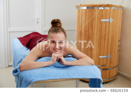 Girl relaxes in a spa salon before massage Girl relaxes in a spa salon before massage 98826159
