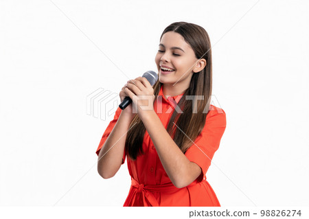 photo of glad singer teen girl hold microphone. teen girl singer singing with microphone 98826274