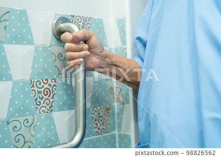 Asian senior or elderly old lady woman patient use toilet bathroom handle security in nursing hospital ward, healthy strong medical concept. Asian senior or elderly old lady woman patient use toilet bathroom handle security in nursing hospital ward, healthy strong medical concept. 98826562