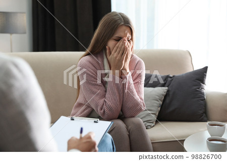 Professional psychotherapist working with patient in office Professional psychotherapist working with patient in office 98826700