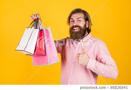 best day ever. mature hipster with beard hold present pack. brutal caucasian hipster with gift. male go shopping with purchase. successful shopaholic. bearded man ready for holiday. sale and discount best day ever. mature hipster with beard hold present pack. brutal caucasian hipster with gift. male go shopping with purchase. successful shopaholic. bearded man ready for holiday. sale and discount 98826841