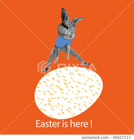 Man with bunny head jumping over painted egg. Creative design on red background. Happy Easter Man with bunny head jumping over painted egg. Creative design on red background. Happy Easter 98827213