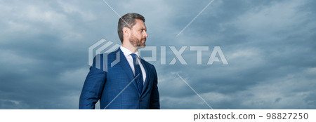 Portrait of businessman looking aside. Businessman in suit. Serious grizzled businessman Portrait of businessman looking aside. Businessman in suit. Serious grizzled businessman 98827250