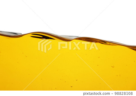 Cooking oil flow isolated on white. Color liquid Cooking oil flow isolated on white. Color liquid 98828108