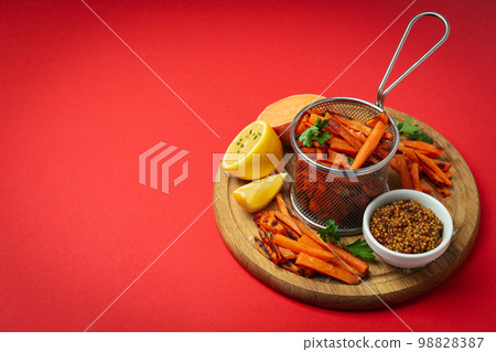Concept of tasty food, fried sweet potato, space for text Concept of tasty food, fried sweet potato, space for text 98828387
