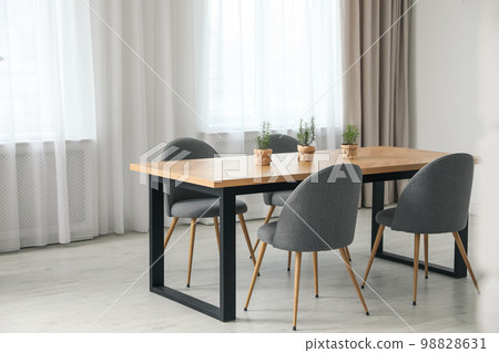 Modern room interior with chairs and table Modern room interior with chairs and table 98828631