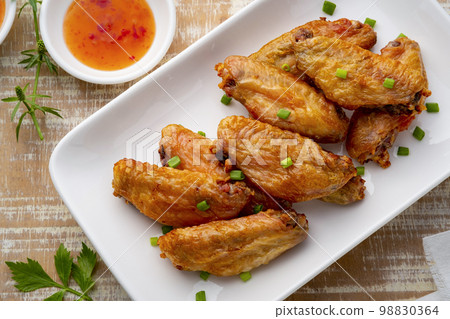 Close up Crispy Chicken Wing (wingette) with Fish Sauce,Cooked by Electric Hot Air Fryers Oven Oilless Cooker Close up Crispy Chicken Wing (wingette) with Fish Sauce,Cooked by Electric Hot Air Fryers Oven Oilless Cooker 98830364