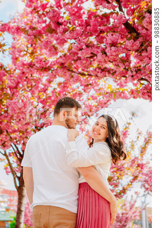 couple lovers under blooming sakura tree couple lovers under blooming sakura tree 98830885