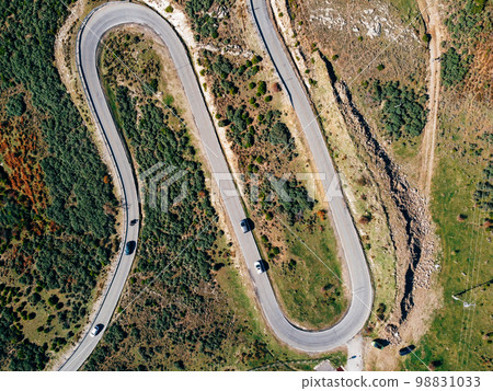 Aerial view of winding road. Highway through the woodland 98831033