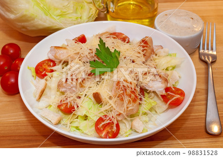 Caesar salad with chicken and crackers 98831528