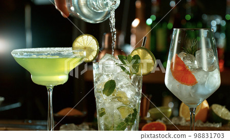 Fresh various cocktails on the bar, dark toned background 98831703