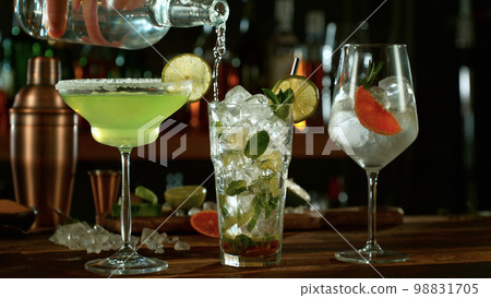 Fresh various cocktails on the bar, dark toned background 98831705