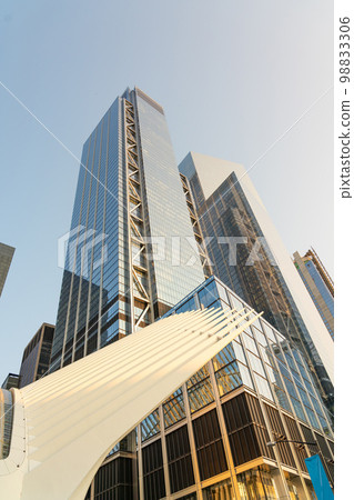 View of the tower of a skyscraper made of glass and concrete from the Cortlandt metro station View of the tower of a skyscraper made of glass and concrete from the Cortlandt metro station 98833306