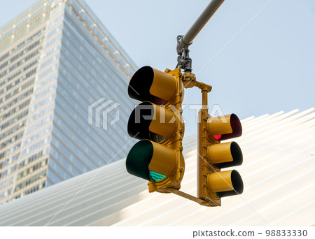 Traffic light with red and green light against the backdrop of the world trade center Traffic light with red and green light against the backdrop of the world trade center 98833330