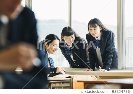 High school girl talking with classmates High school girl talking with classmates 98834786
