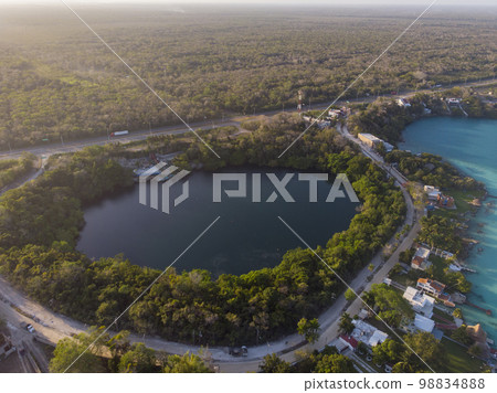 Aerial Drone Shot of Beautiful Cenote Azul and view on 7 seven colors lagoon in Bacalar, Quintana Roo, Mexico Aerial Drone Shot of Beautiful Cenote Azul and view on 7 seven colors lagoon in Bacalar, Quintana Roo, Mexico 98834888