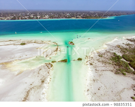 Aerial Drone Shot of the Pirate Channel of Bacalar Quintana roo, Mexico. Shipwreck island in Lagoon of seven colors Aerial Drone Shot of the Pirate Channel of Bacalar Quintana roo, Mexico. Shipwreck island in Lagoon of seven colors 98835351