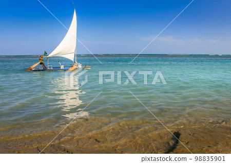 Carneiros Beach and jangada boat in Pernambuco, Northeastern Brazil, South America Carneiros Beach and jangada boat in Pernambuco, Northeastern Brazil, South America 98835901