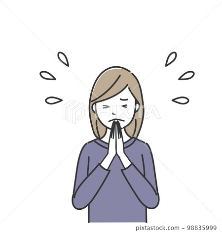 A woman praying with her hands together 98835999