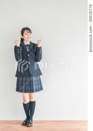 Smiling high school student, junior high school student, high school girl (uniform, school uniform, Asian) who poses in a school classroom Smiling high school student, junior high school student, high school girl (uniform, school uniform, Asian) who poses in a school classroom 98836776