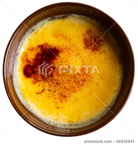 Tasty dessert catalana crema served with caramel crust served with spoon Tasty dessert catalana crema served with caramel crust served with spoon 98836845