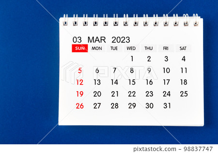 The March 2023 Monthly desk calendar for 2023 year on blue background. The March 2023 Monthly desk calendar for 2023 year on blue background. 98837747