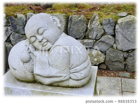 A small monk sleeping with a wooden fish Stone Buddha Jizo 98838353