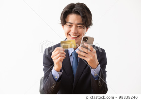 Businessman credit card smartphone Businessman credit card smartphone 98839240