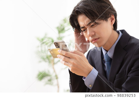 Businessman credit card smartphone Businessman credit card smartphone 98839253