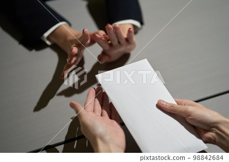 Hand of a woman who refuses to receive money Hand of a woman who refuses to receive money 98842684