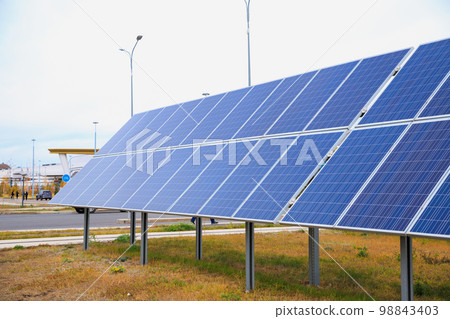 Ground mounted Solar power photovoltaic panels on grass. Solar power system. Close-up. Ground mounted Solar power photovoltaic panels on grass. Solar power system. Close-up. 98843403