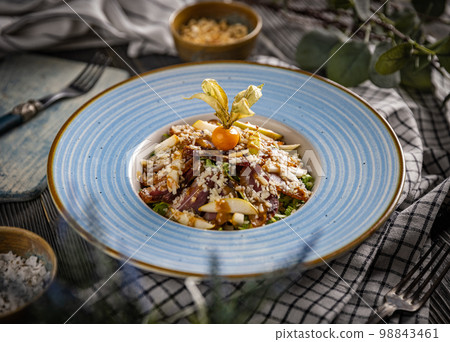 Salad with cured ham 98843461