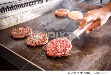 Chef cook frying meat 98843632