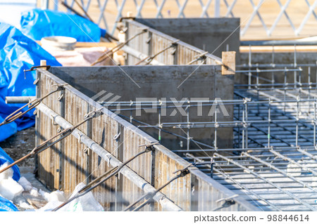 Construction site, foundation work, reinforcement work, metal form, steel formwork 98844614