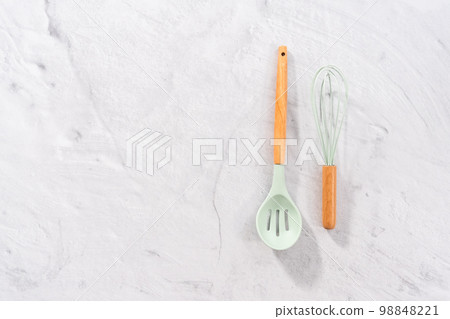 Flat lay. Silicone cooking utensils with wooden handle. Flat lay. Silicone cooking utensils with wooden handle. 98848221