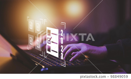 Hand using laptop and 2023 with folder of document Management System, online documentation database and process automation to efficiently manage files work, knowledge, Corporate business technology, 98849059