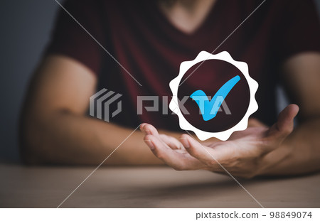 Quality assurance of business services, Businessman Hand shows the sign of the top service Quality assurance in Black background , Guarantee, Standards, ISO certification and standardization concept. Quality assurance of business services, Businessman Hand shows the sign of the top service Quality assurance in Black background , Guarantee, Standards, ISO certification and standardization concept. 98849074